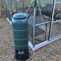 Vitavia 100L water butt with stand, tap and downpipe connector beside a greenhouse