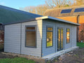 Suresheds Kingsdale Contemporary composite garden room in light grey composite cladding with anthracite uPVC French doors and windows