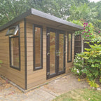 Suresheds Kingsdale Contemporary composite garden room in oak timber-look composite cladding with dark brown trims