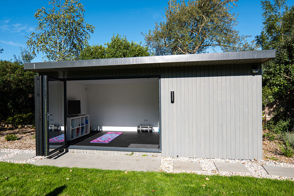 PentHaus garden office interior with bi-fold doors open
