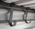 Lifelong steel storage hooks fitted inside a steel shed