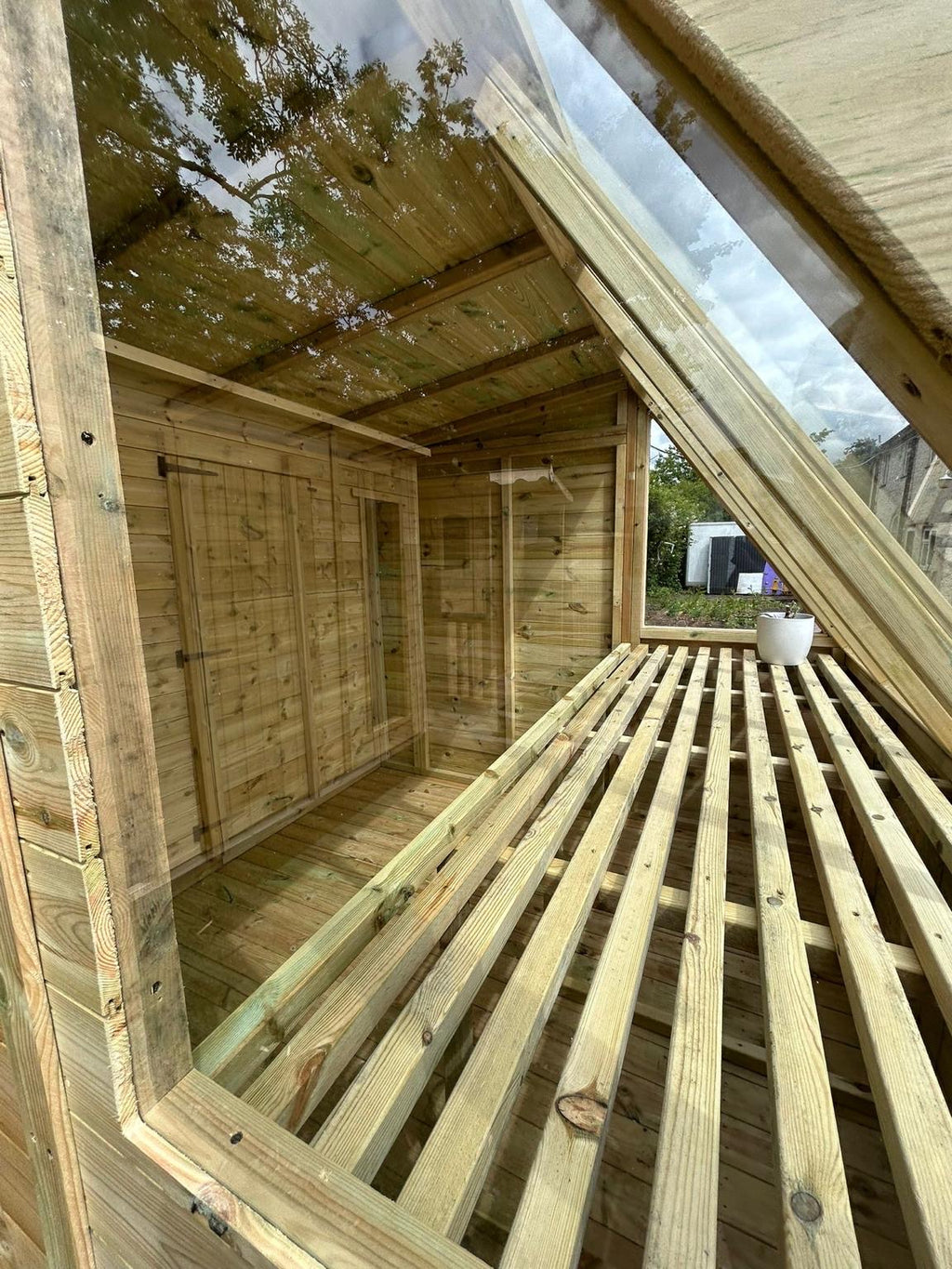 Inside the LOJ combi greenhouse shed with slatted staging