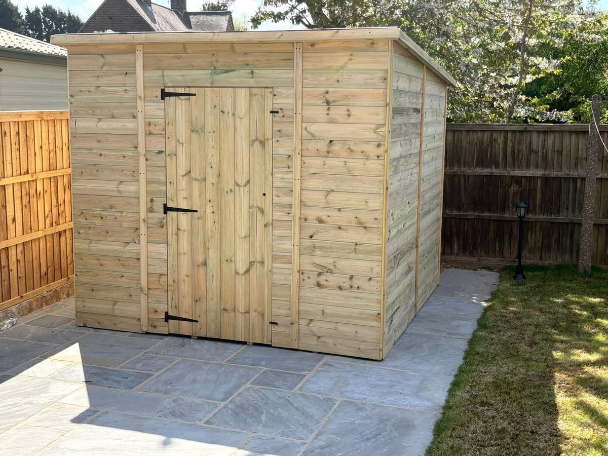LOJ pent shed installed on a patio